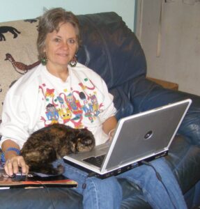 Donna Blumberg with cat and laptop